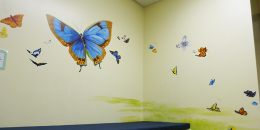 hand painted mural for Mountainland Pediatrics with birdhouses, bears, butterflies, owls, turtles, ducks, deer, fox, rabbits, flowers, mountain lion, 