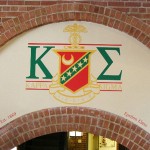 hand painted greek letters fraternity emblem by Boulder Murals