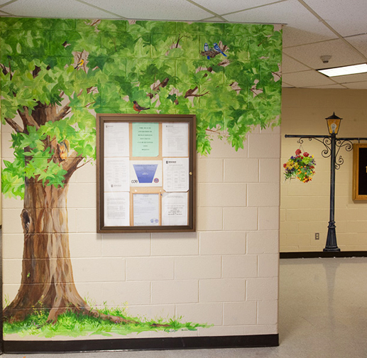 hand painted mural in Day Treatment Center - Community Reach Center by Boulder Murals, dogs, playground, lamp post, tree, squirrel, vegetables, 