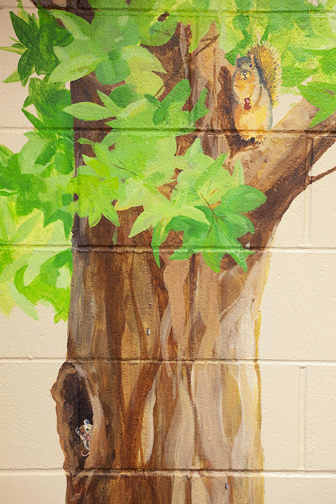 hand painted mural in Day Treatment Center - Community Reach Center by Boulder Murals, dogs, playground, lamp post, tree, squirrel, vegetables, 